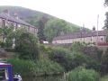 Friezland. Here you can see the characteristic local weavers cottages and the high bleak moorland above. - Location: Friezland - Canal: Huddersfield Narrow