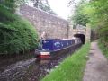 Lock 21W in Uppermill is approached through a surprisingly long tunnel which goes diagonally under the main road. This side is countryside whereas the other side is in the hubbub of a small town. - Location: Uppermil - Canal: Huddersfield Narrow