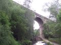 At Lock 23W the Saddleworth railway viaduct strides above a road bridge, the lock and an aqueduct over the River Tame! The road bridge is actually beneath the viaduct itself. - Location: Dobcross - Canal: Huddersfield Narrow