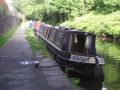We moored for the night at Marsden just above lock 42E (NB locks are now designated E for east and count down to Huddersfield). We woke up the next morning to find that the water level had dropped eight inches and we were solidly aground. Apparently the last boater through the lock had not fully closed a paddle and since the lock leaks all that water had run away. It took ten hours to refill the pound which stretches for over 4 miles from Diggle top lock through the tunnel to Marsden. That was with the feeder channels up on the hill running at full bore!  - Location: Marsden - Canal: Huddersfield Narrow