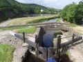 Below Lock 33E the canal runs between Sparth canal storage reservoir (left) and the mill pond for Cellars Clough Mill. This is below the main Marsden flight and the locks are a little less close together. The HNC water was often a peaty-brown colour. - Location: Marsden - Canal: Huddersfield Narrow