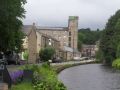 Debdale just below Lock 24E (note guillotine in the distance) where there is a lovely line of renovated old canalside buildings which include a bakery, various small businesses, beautifully kept houses and gardens plus Upper Mill Brewery. Despite the name this is actually in Slaithewaite and not to be confused with Uppermills which is a village on the other side of Saddleworth! Whatever the name it was good to see thriving enterprises and this area brought back to useful life. - Location: Slaithewaite - Canal: Huddersfield Narrow