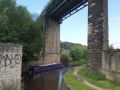 There is quite a sharp turn as you exit lock 5E as you go under the viaduct. The turn is complicated by quite a vigorous bywash! - Location: Huddersfield - Canal: Huddersfield Narrow