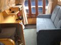 A new sofa bed was purchased in 2016. This is more comfortable than the old one and is light enough to be turned across the boat if preferred