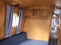 The master bedroom. The bed can be extended into the passageway at night to make a king size bed March 2025